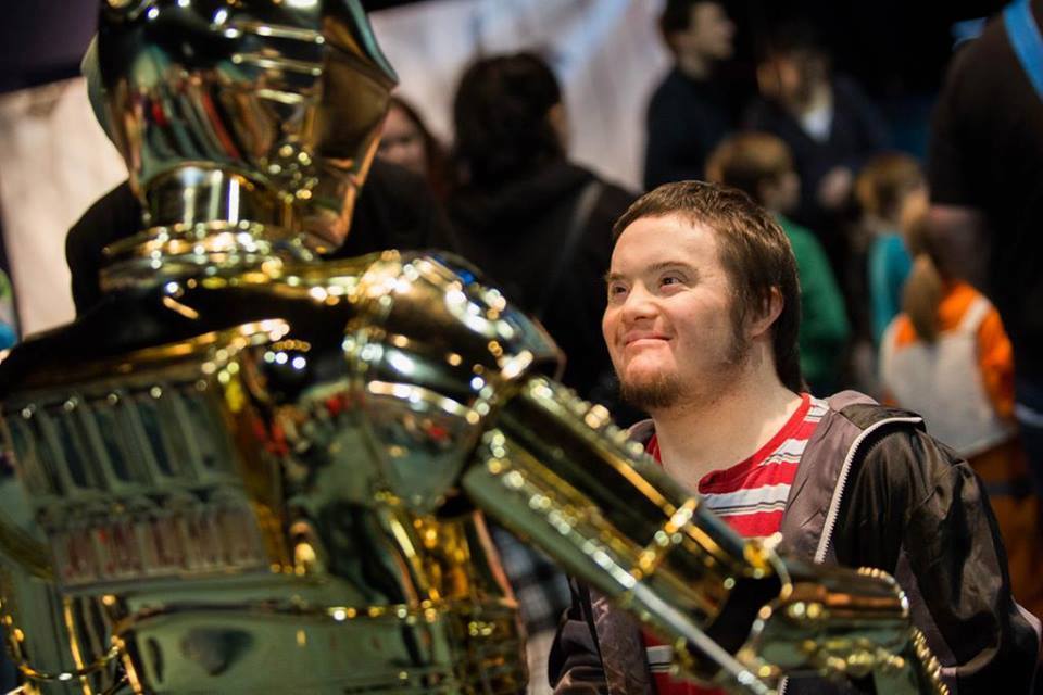 A visitor meeting C-3PO at Feel the Force Day